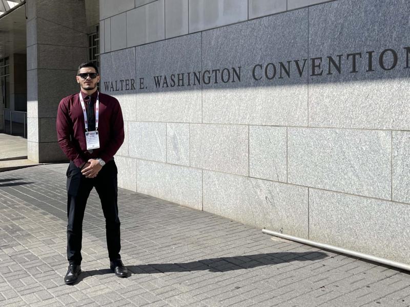 Basel Farhat standing in front of the Walter E. Washington Convention Center in Washington DC
