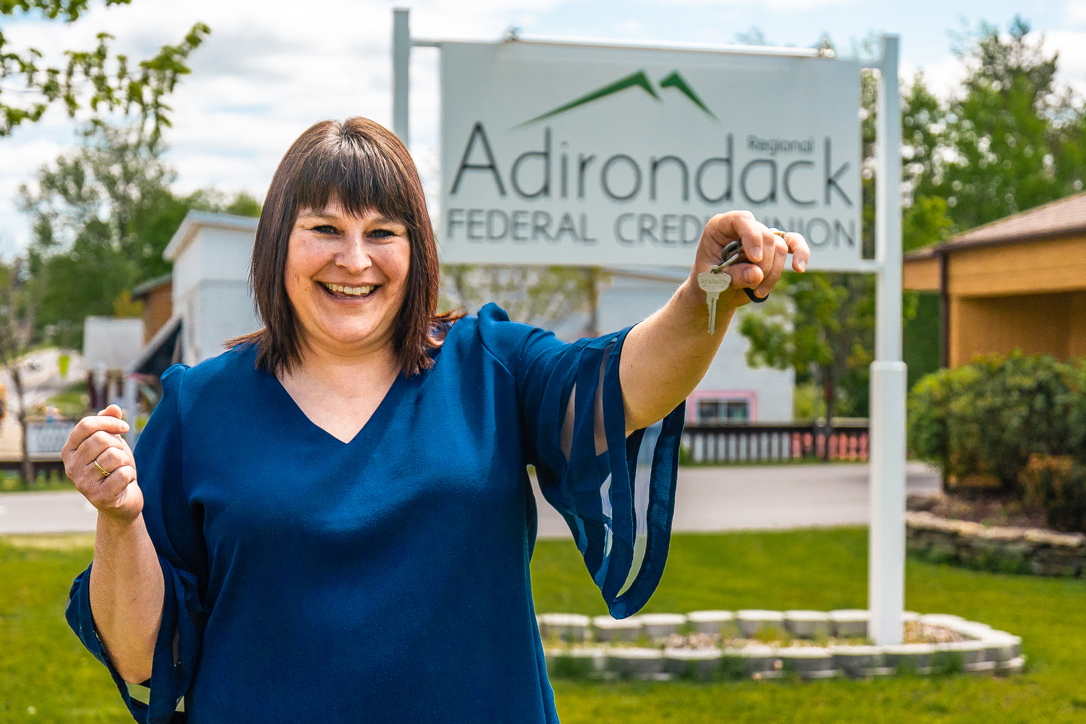 happy women excited about her new mortgage while holding keys