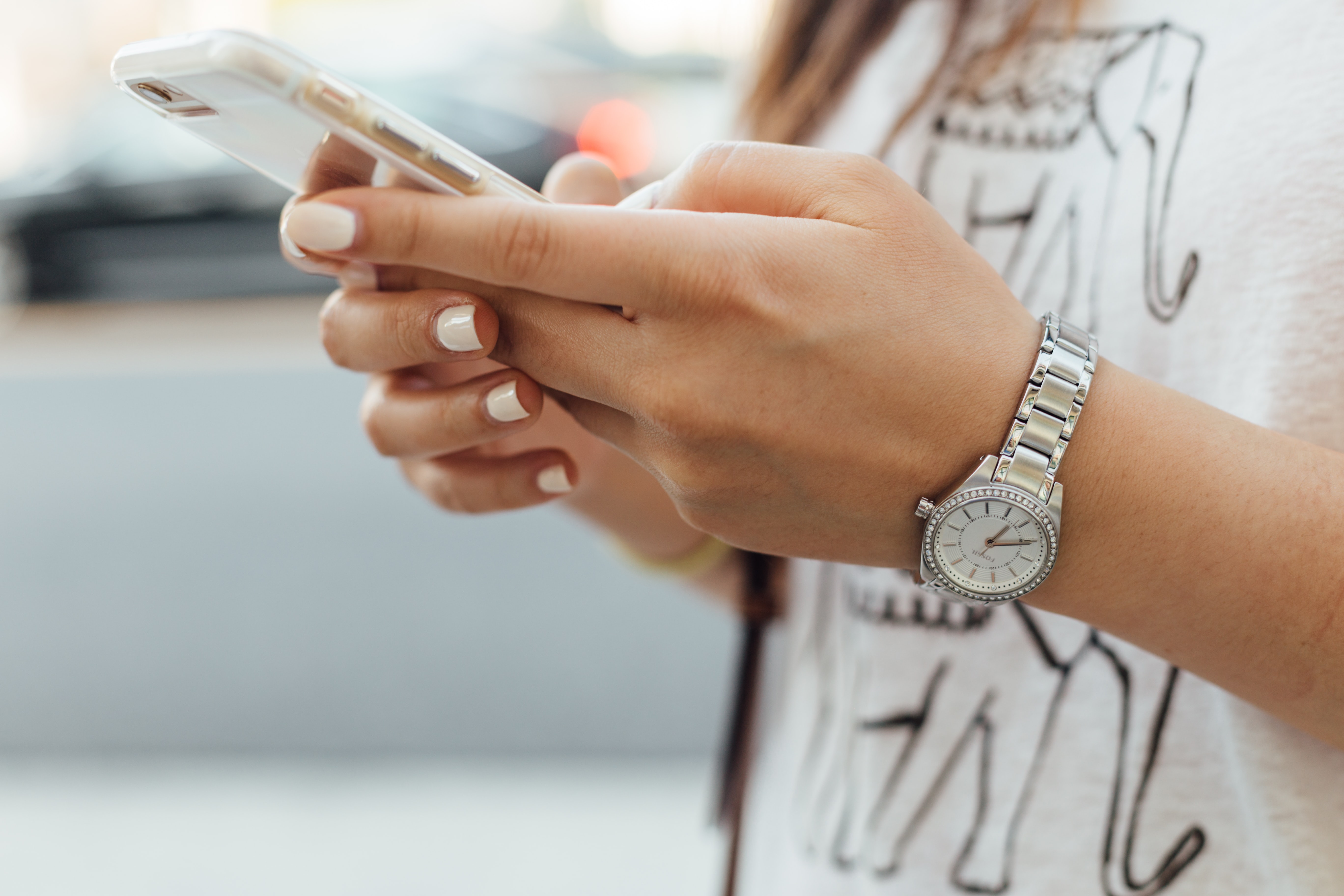 person using phone to check banking app
