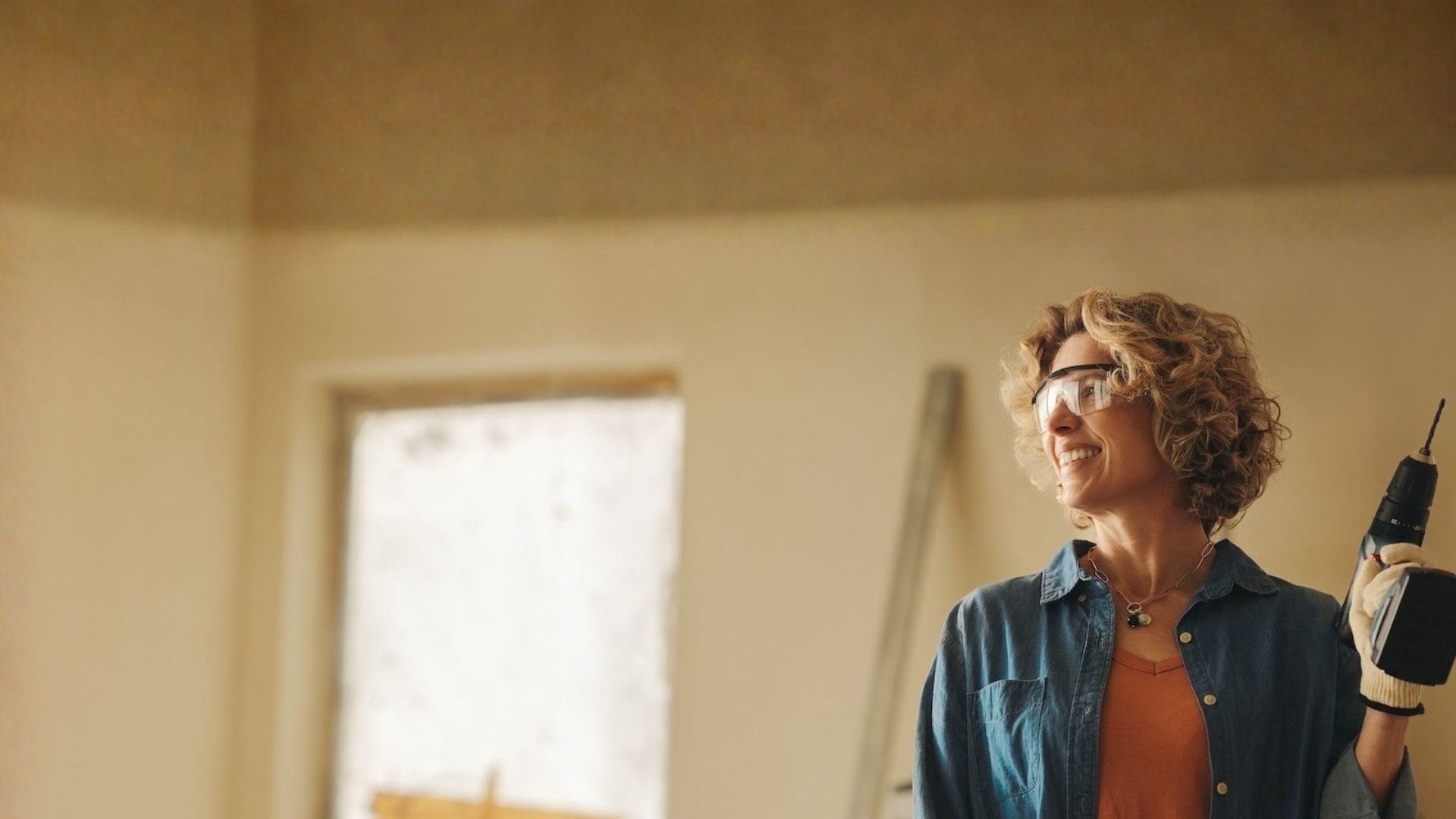 happy woman working on home improvements