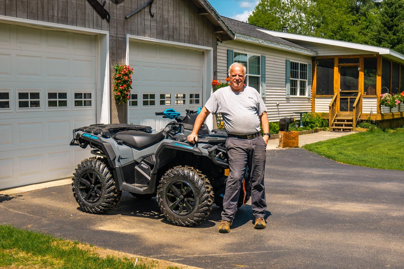 Adirondack regional federal credit union member with his new ATV at home after getting an ATV loan