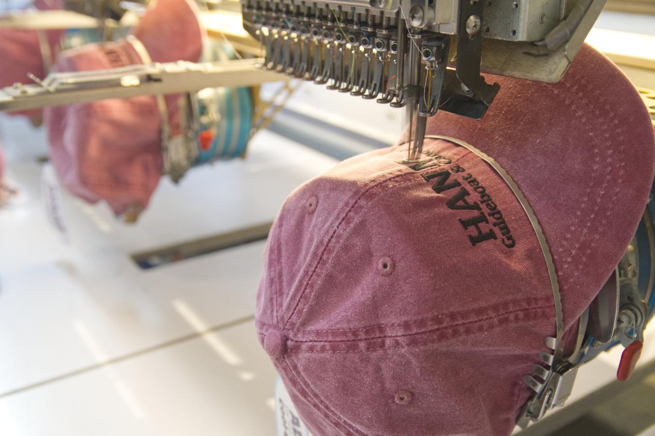Hats in production at Bear Essentials Embroidery 