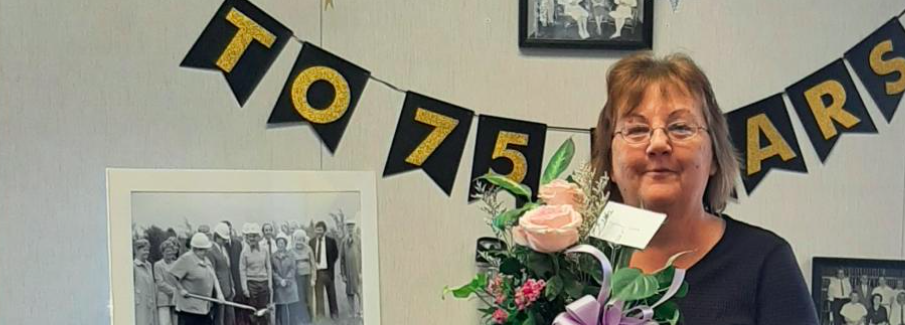 Kathy Love holding flowers