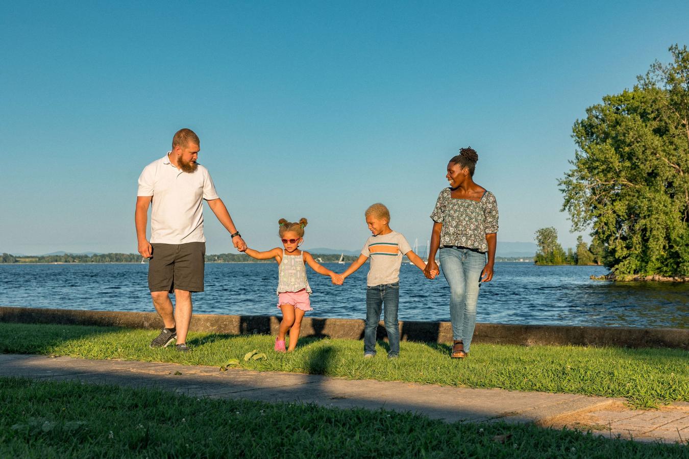 Family walking near water in Plattsburgh NY