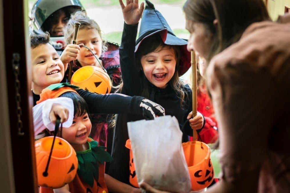 Children in costume trick or treating