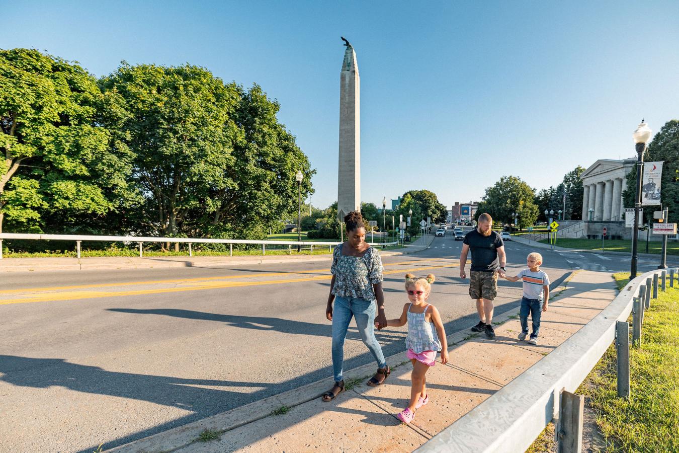 A family walking together through downtown Plattsburgh, NY.