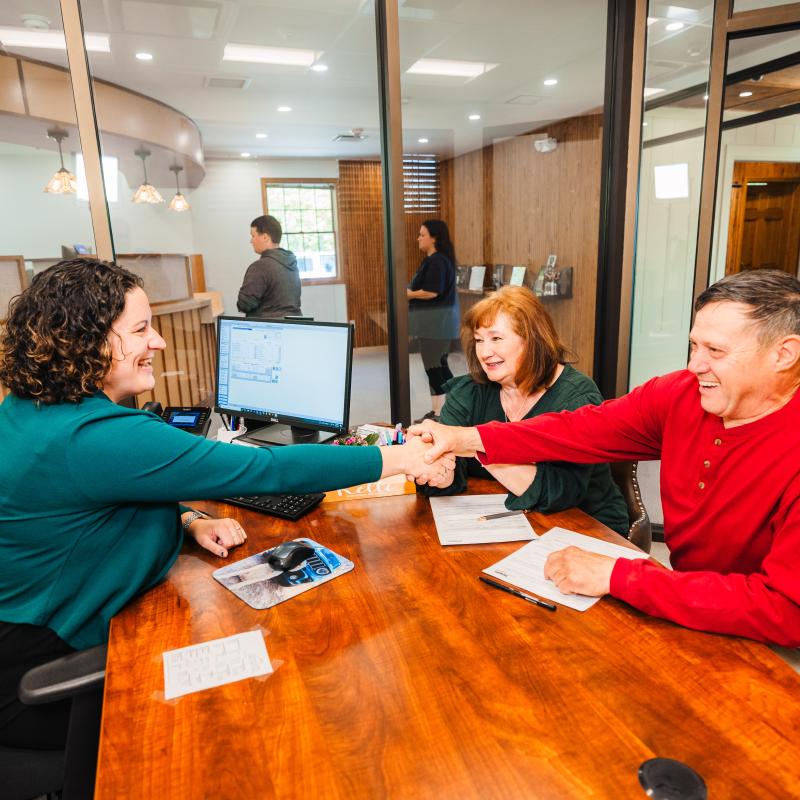 Expert Loan Officer helping a local couple get a mortgage