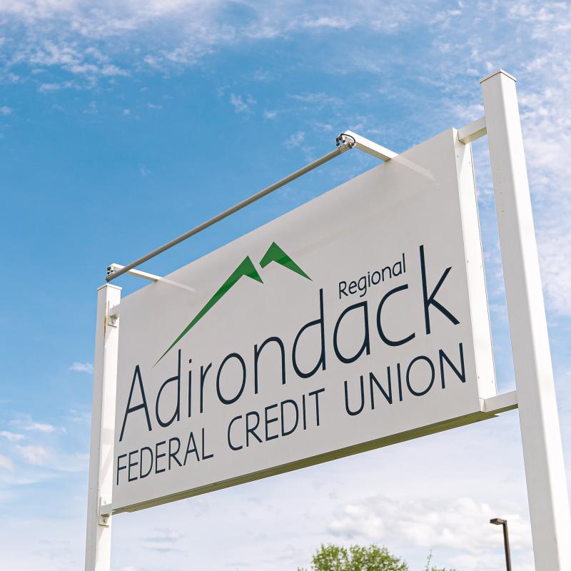 Adirondack Regional Federal Credit Union Tupper Lake Branch road sign