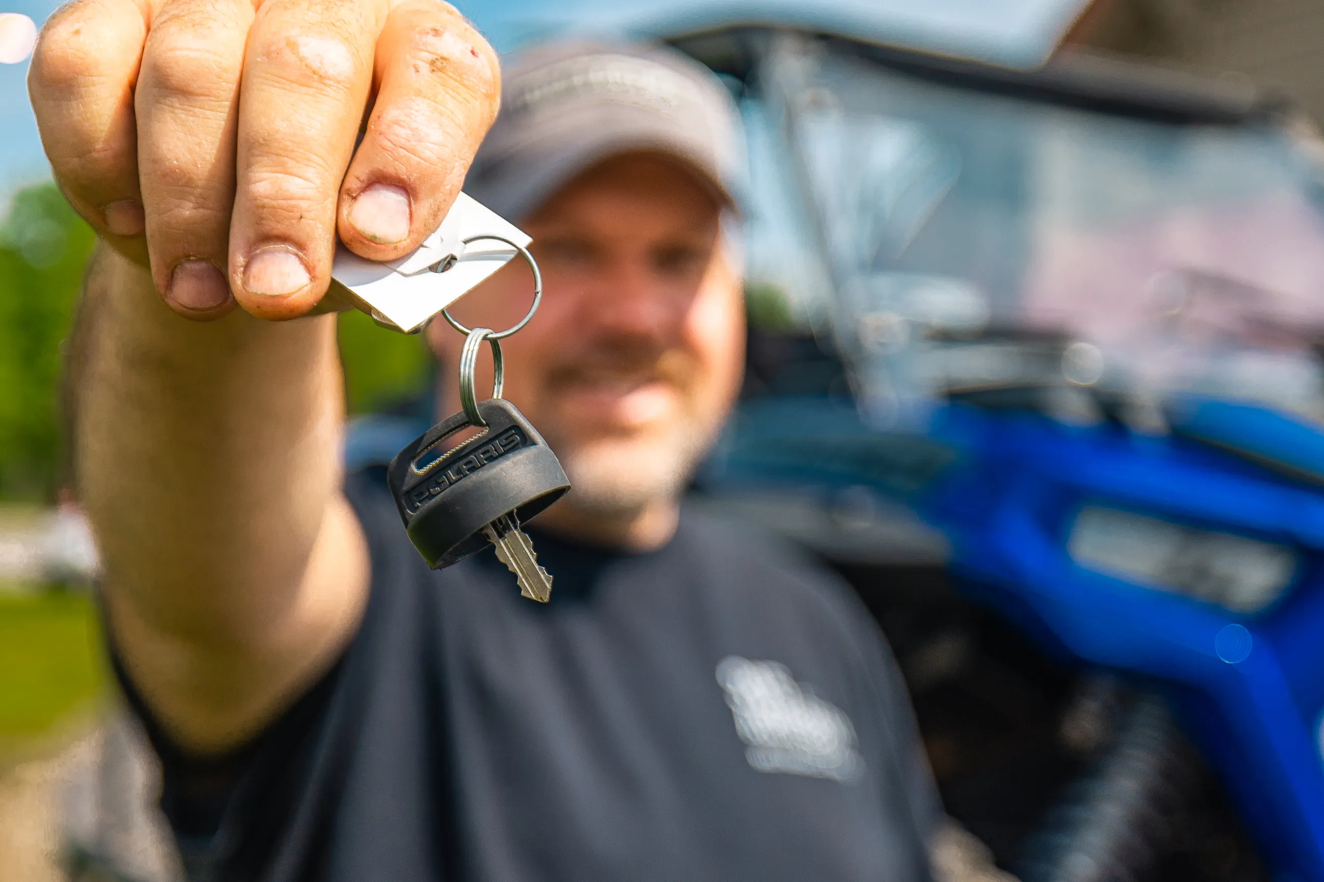 Credit union member holding the leys to his new car in Tupper Lake after getting a vehicle loan